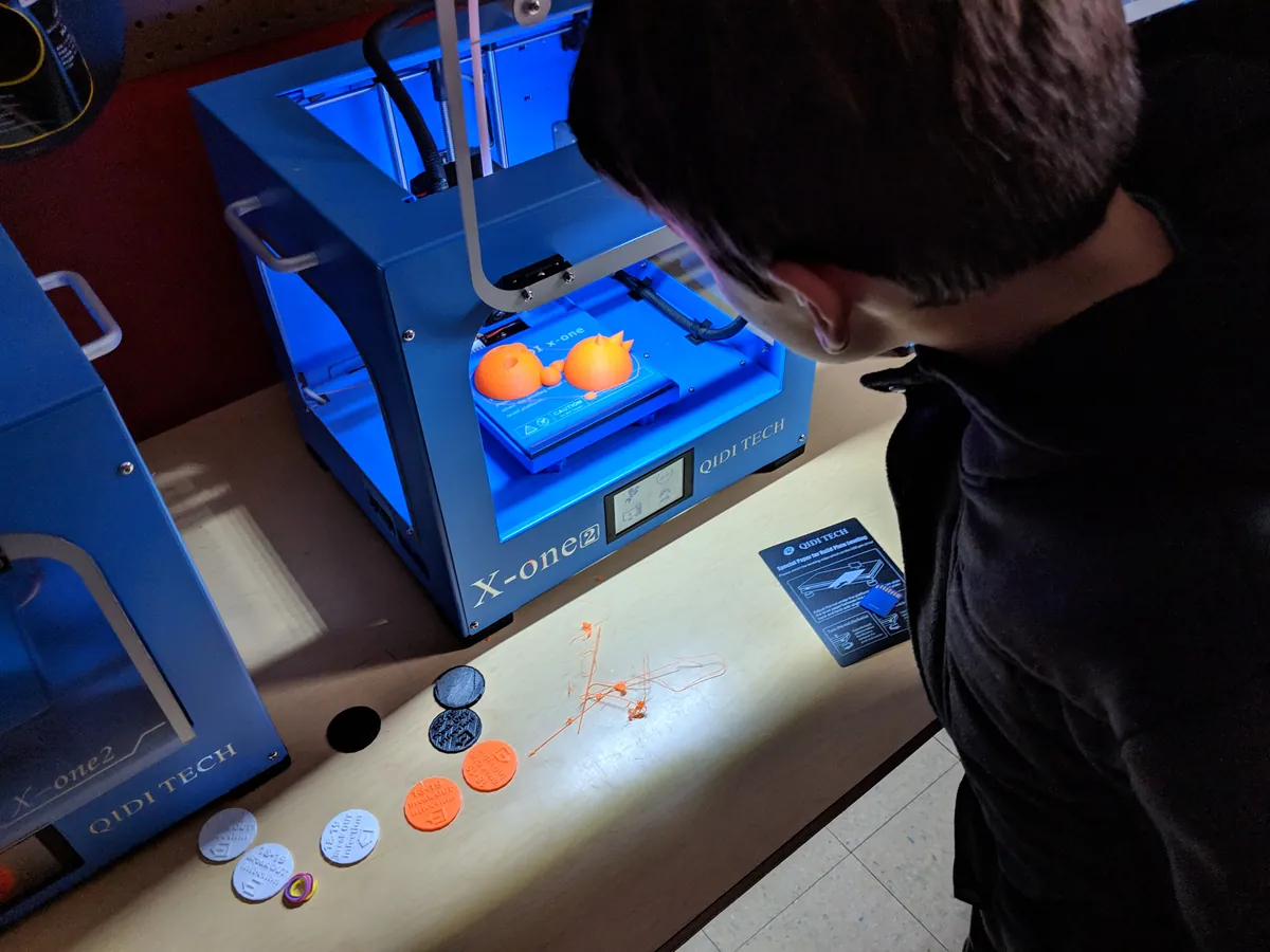 Student using a 3D printer for a hands-on science project